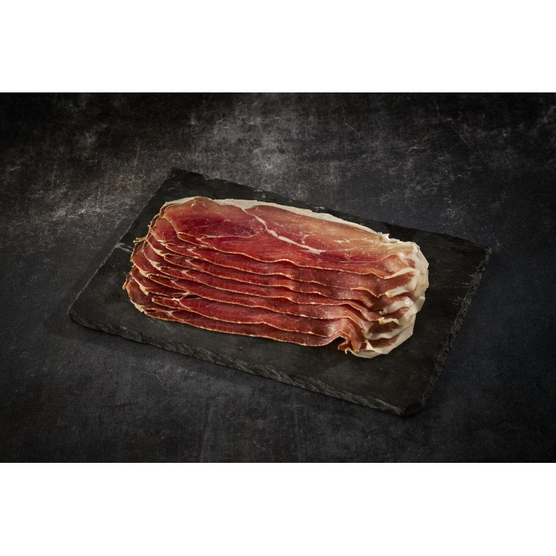 Jambon de Bayonne IGP artisanal en tranches sur plateau d'ardoise